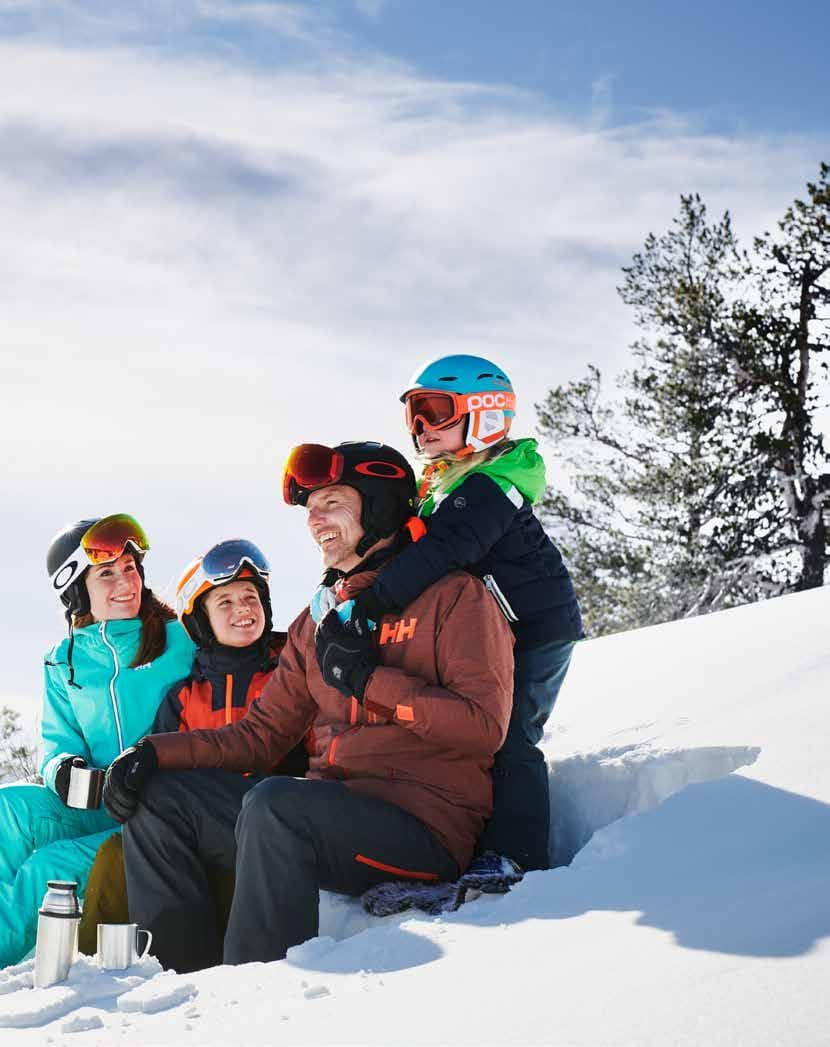 Nylandsbacken in Sweden - a group of people sitting in the snow.
