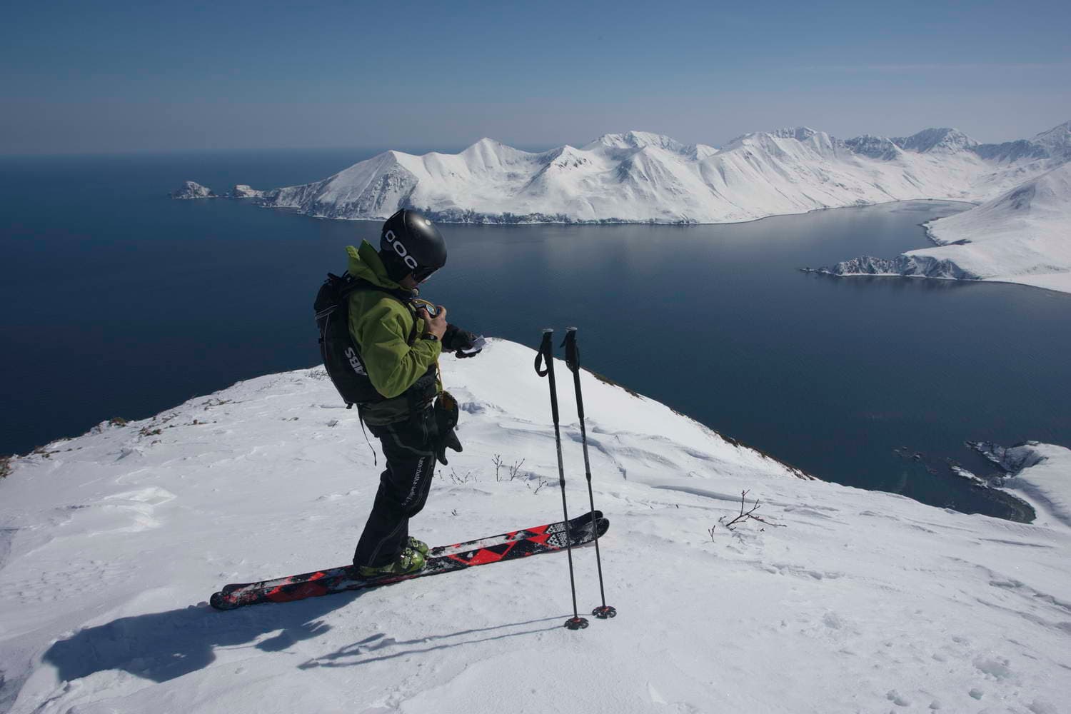 Kamchatka in Russia - a man standing on top of a snow covered mountain.