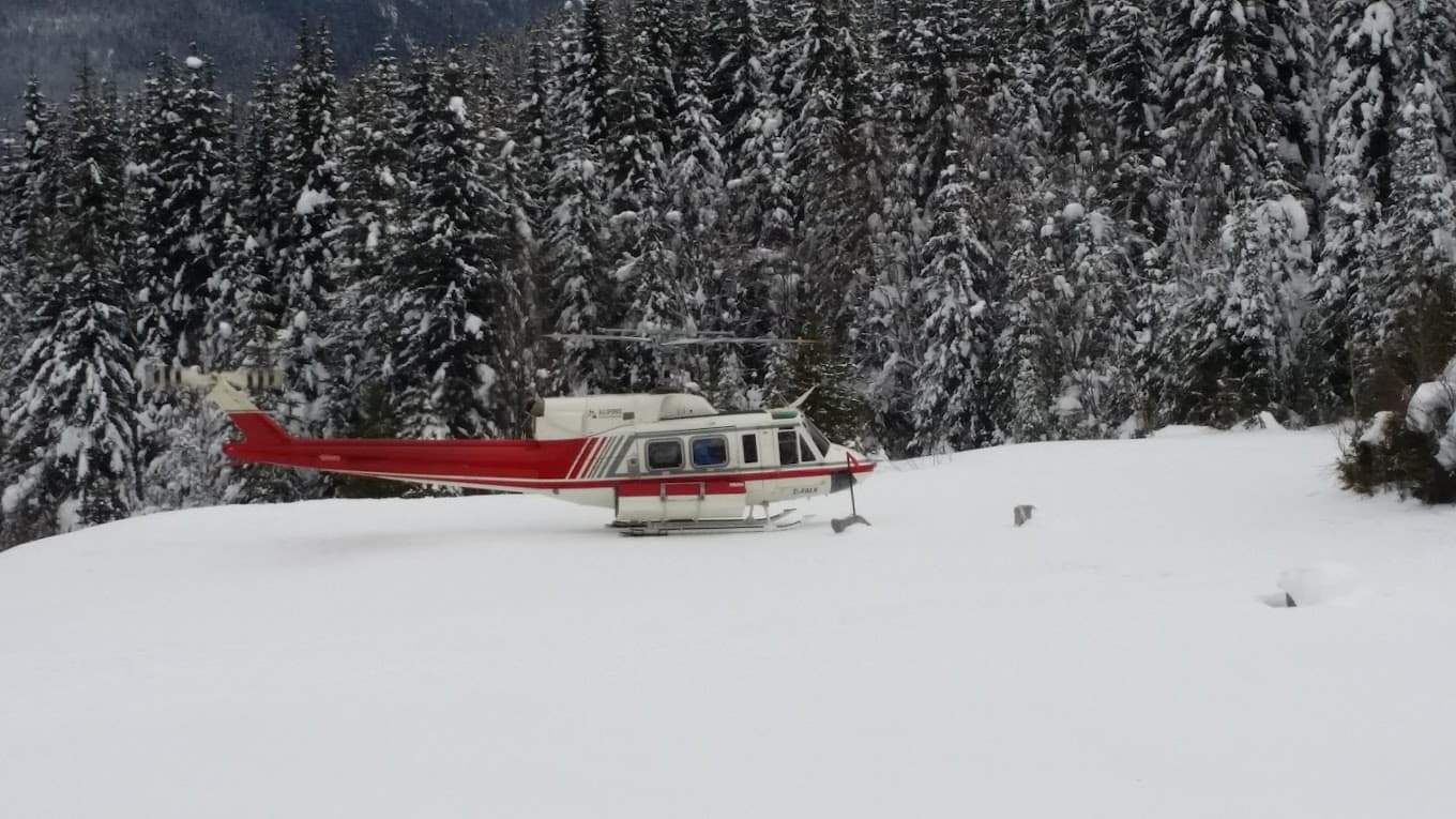 A snowmobile in action at Bobby Burns a ski resort in British Columbia Canada. The scene captures the true essence of winter sports in a cold snowy landscape.