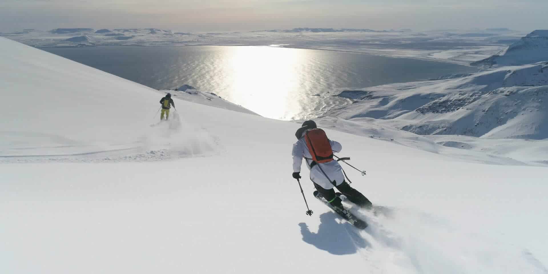 Víking Heliskiing in Iceland - a person skiing down a snowy mountain.