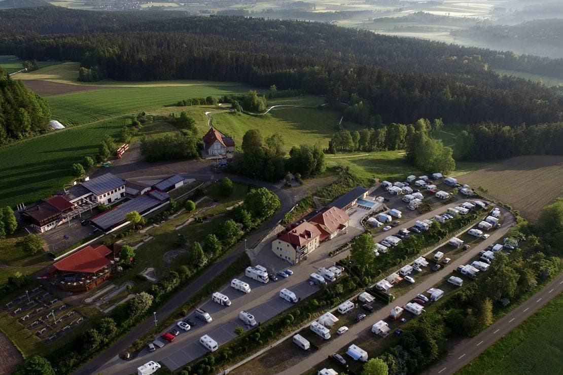 Großbüchlberg – Mitterteich in Germany - an aerial view of a camping site in the mountains.