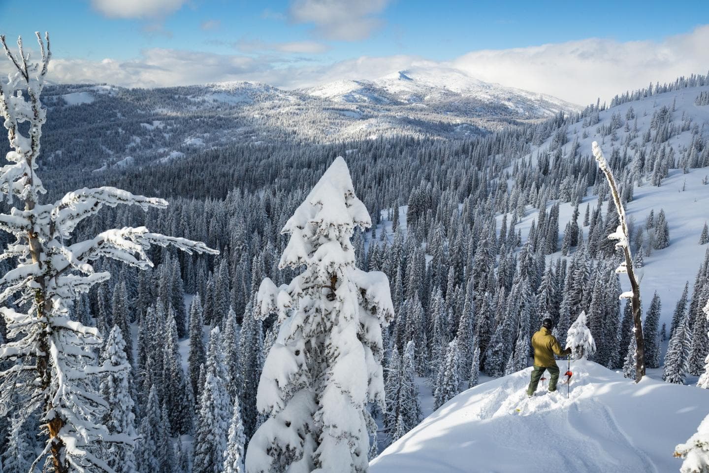 Brundage Mountain in USA - a person skiing down a snow covered mountain.