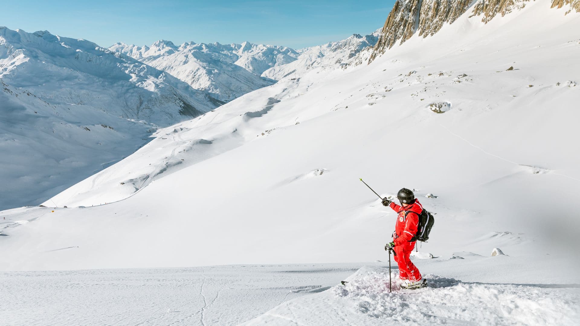 Ski Arena – Aarhus in Denmark - a person in red skiing down a snowy mountain.