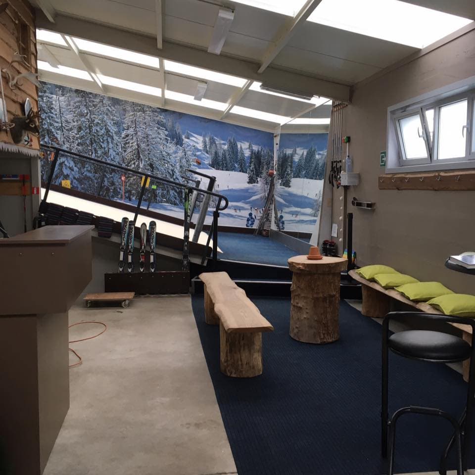 Ski Promotion Deventer in Netherlands - a room with a desk, chair, and window.
