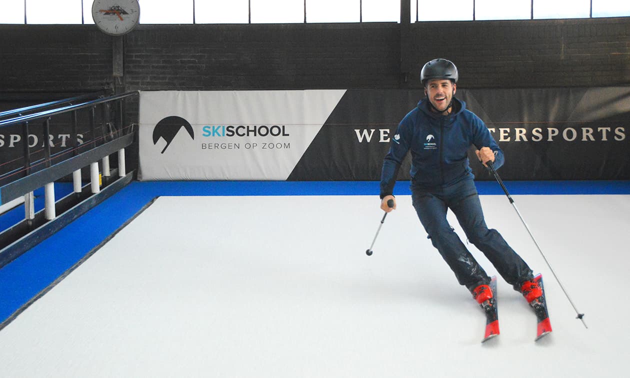 Ego Indoorski – Bergen op Zoom in Netherlands - a young boy is skiing on a white surface.