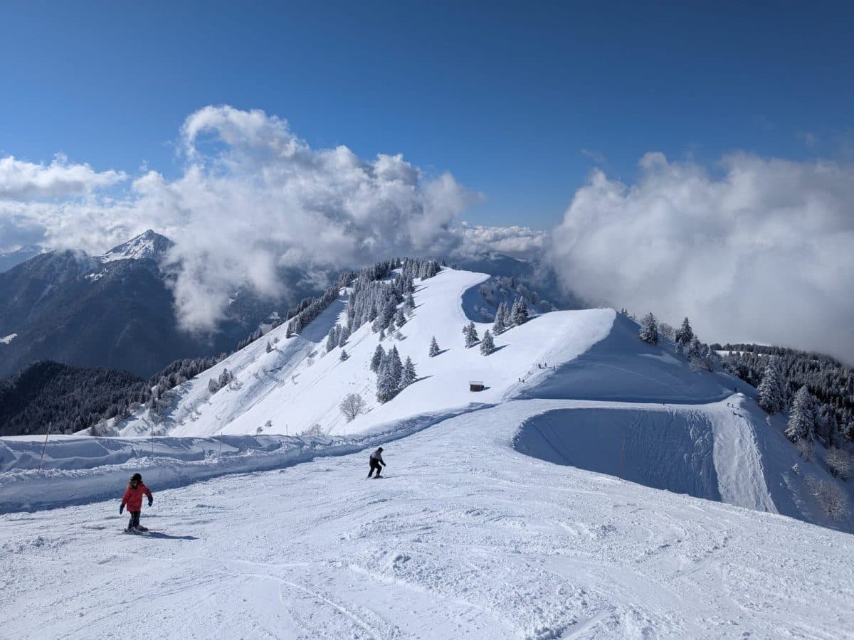 Thollon les Mémises in France - a person skiing down a snow covered mountain.