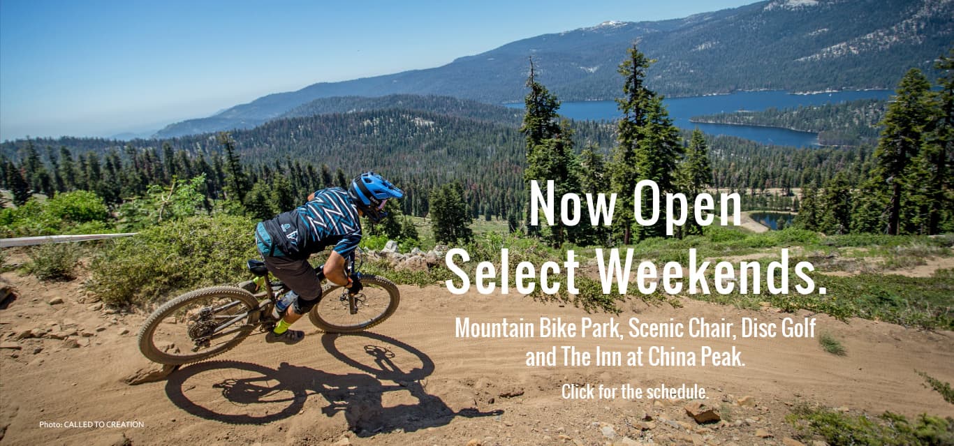 China Peak Mountain Resort in USA - a person riding a mountain bike on a trail.