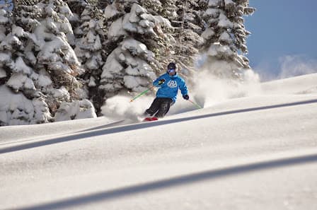 Winter sports enthusiasts enjoy a day at Dodge Ridge in Pinecrest, California. Skiers and snowboarders dominate the scene, gliding down frosty slopes at the popular ski resort.