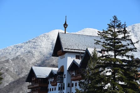 Winter sports centre, challet, and ski resort in the snowy landscape at Valmalenco Bernina in Valtellina, Italy, creating an idyllic winter sports scene.