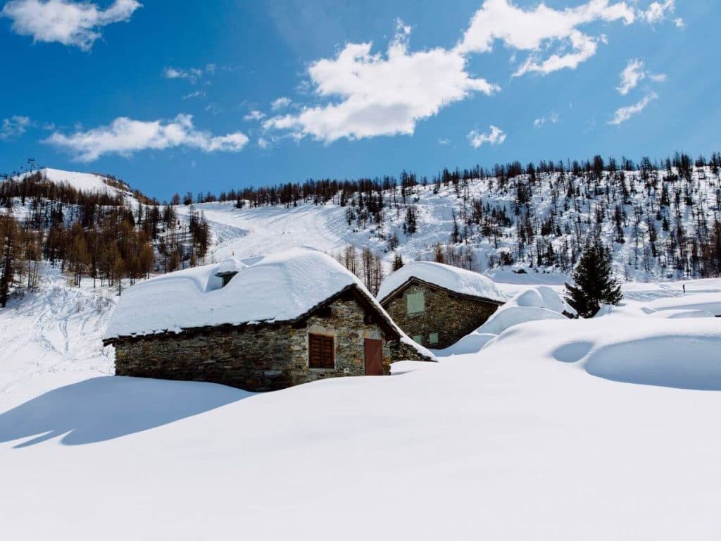 Valmalenco Bernina in Italy - a house in the middle of a snowy mountain.