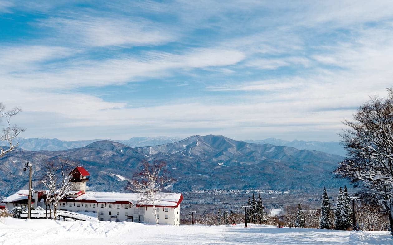 Myoko Akakura Kanko in Japan - blue sky with white clouds.