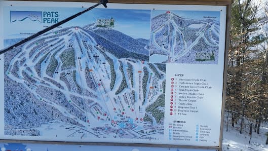 A breathtaking view of the Pats Peak ski resort in Henniker, New Hampshire, featuring its pristine ski slopes and a barely discernible ski lift in the heart of a winter sports heaven.