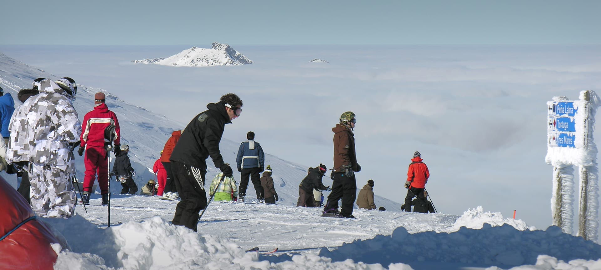 Alto Campoo in Spain - a group of people standing on top of a mountain.