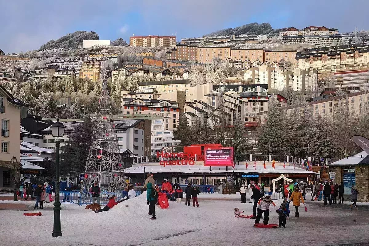 Alto Campoo in Spain - a group of people are playing in the snow.