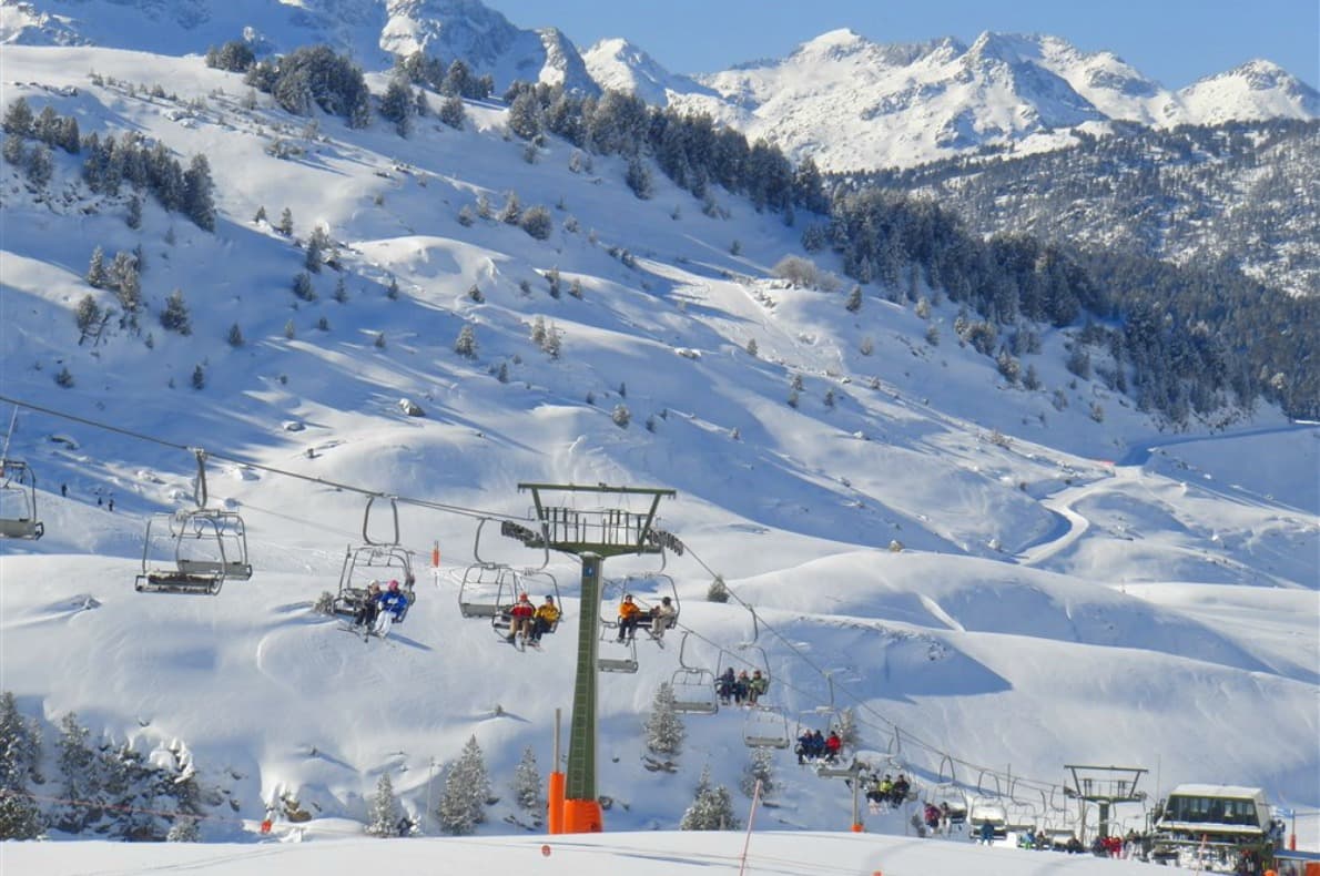 Alto Campoo in Spain - a ski lift going up a snowy mountain.