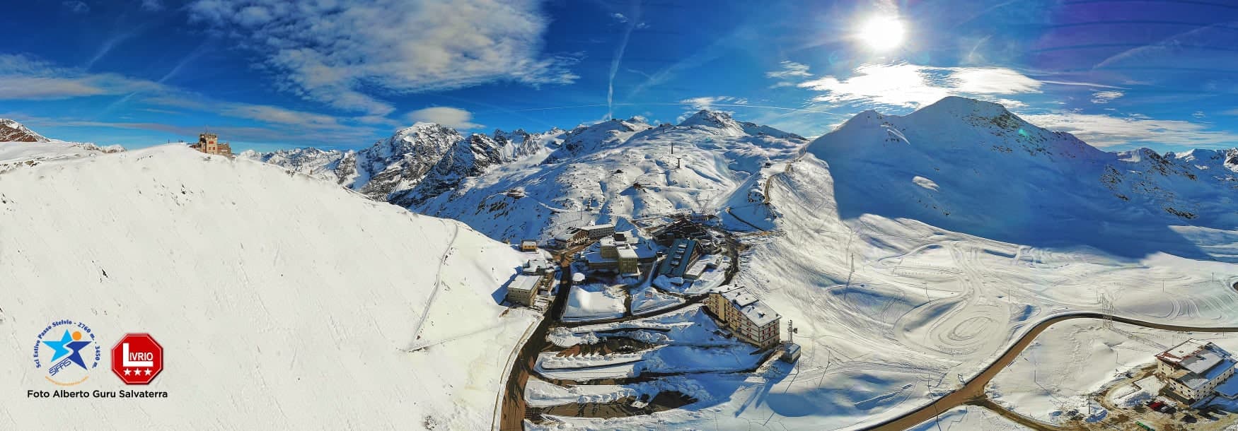 Passo dello Stelvio in Italy - a view from the top of a snowy mountain.