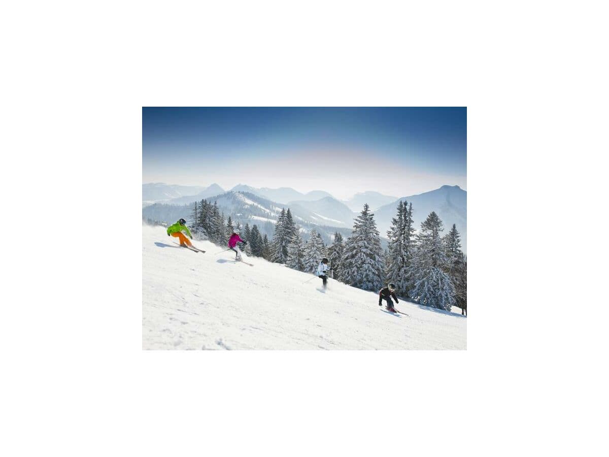 Gaissau-Hintersee in Austria - a group of people skiing down a mountain.