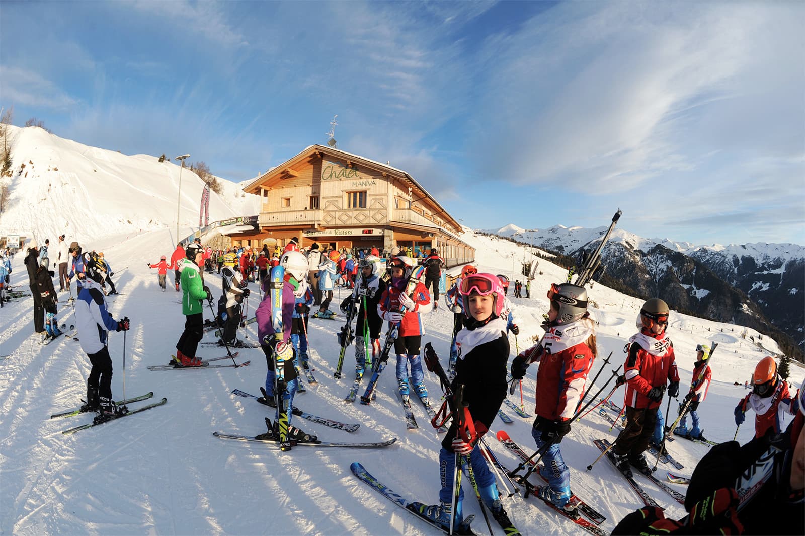 Passo Maniva in Italy - a large group of people skiing down a mountain.