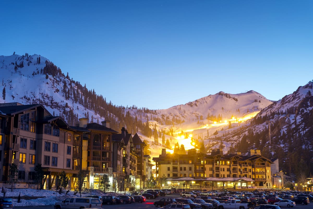 View of Palisades Tahoe ski resort in Lake Tahoe, California featuring a stunning winter scenery with a charming chalet in the backdrop.
